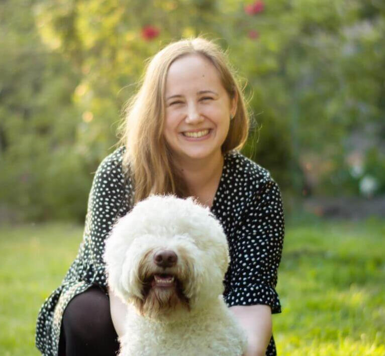 Online English and French lessons for young learners – meet Milena Milena, ESL and French tutor, smiling with her dog, specializing in English for children and teens